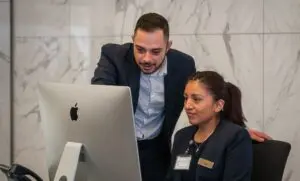 Man and Woman working together on a PC